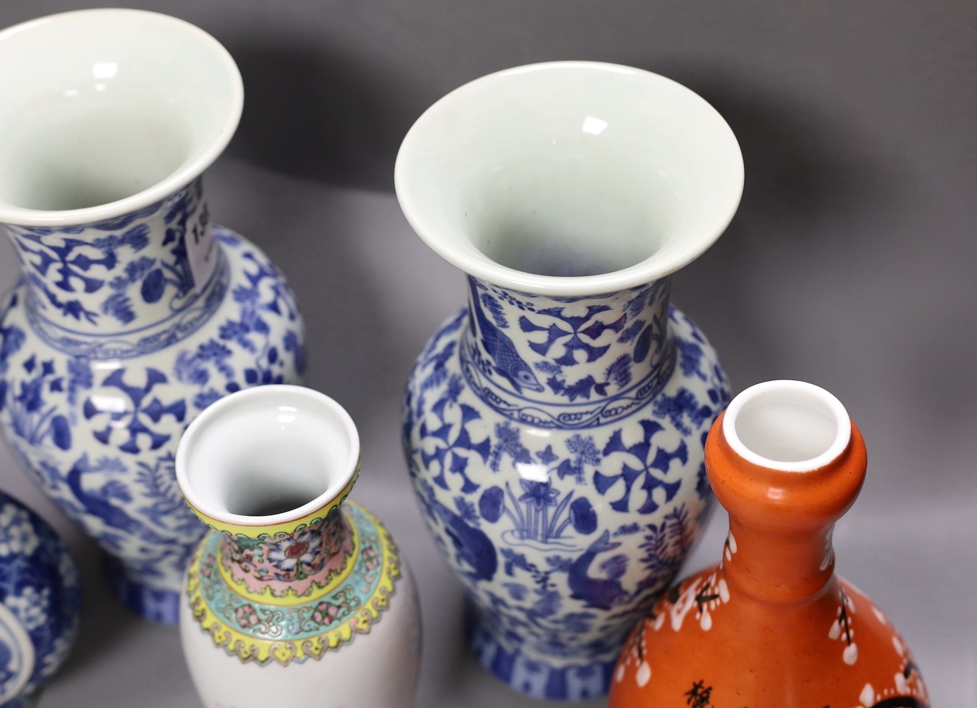 A pair of Chinese blue and white vases, two other vases and a moon flask, tallest 28cm